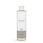 SWISH shampoo in Karmameju-Flasche mit Klappdeckel und graubraunem Etikett auf weißem Hintergrund